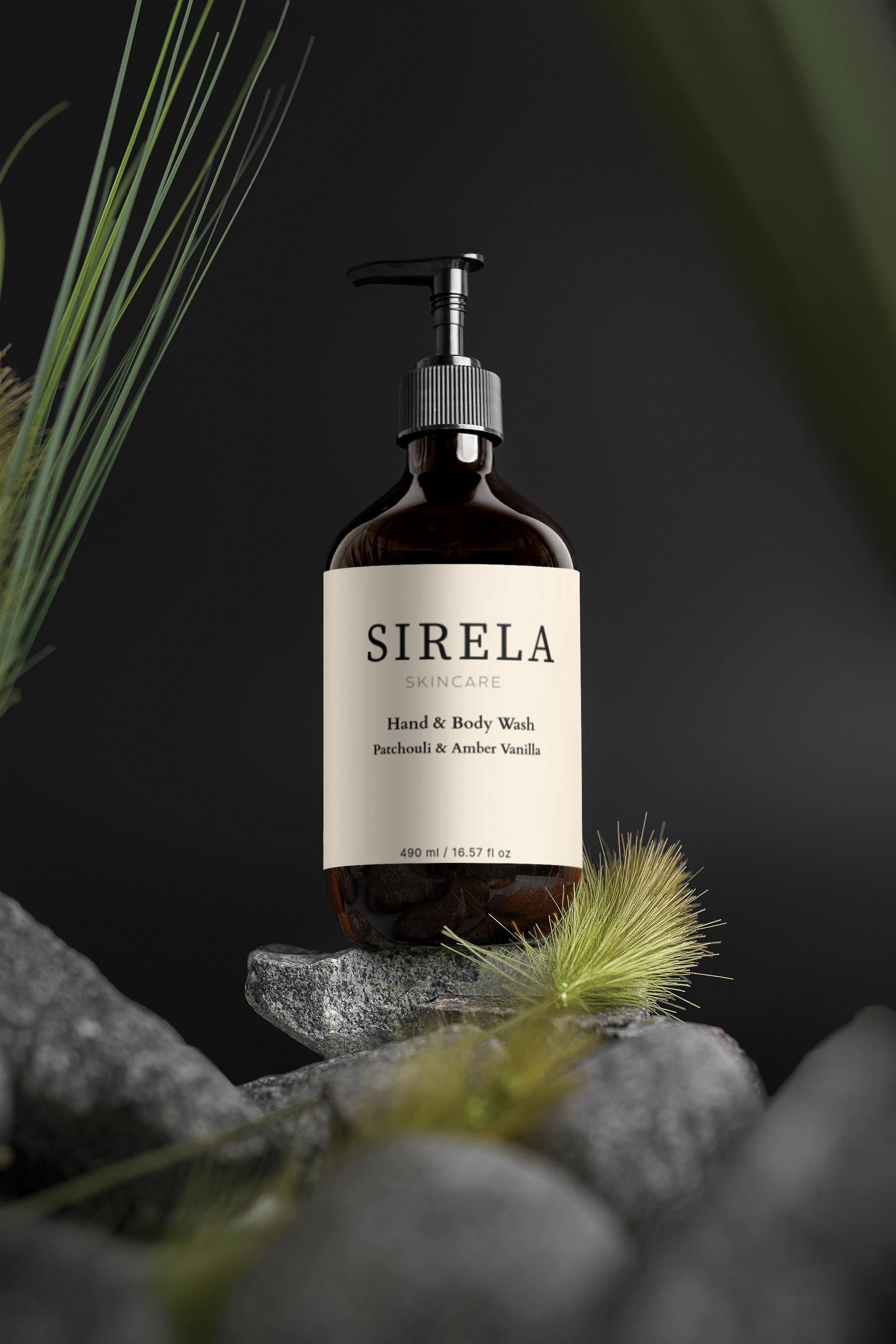 Sirela hand and body wash bottle on a dark background with greenery