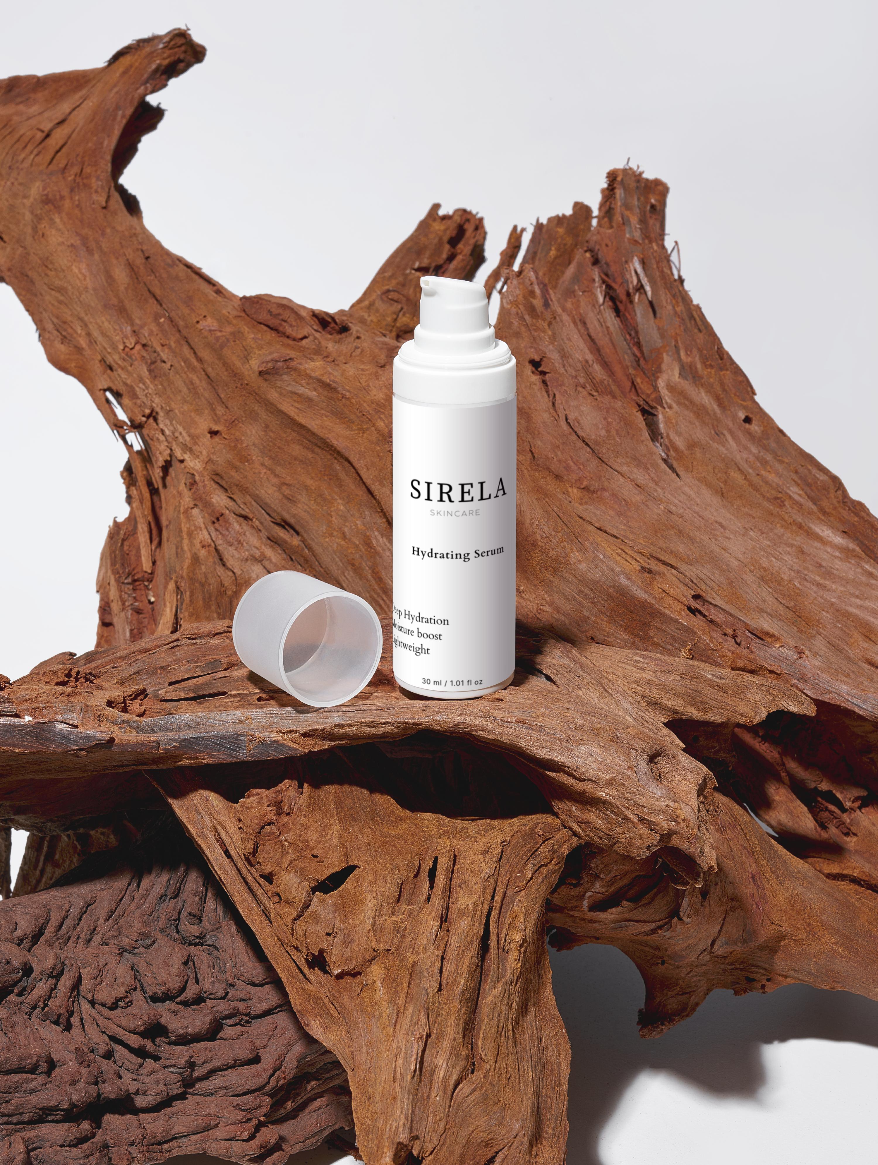 White Sirela bottle on a wooden surface with a white background