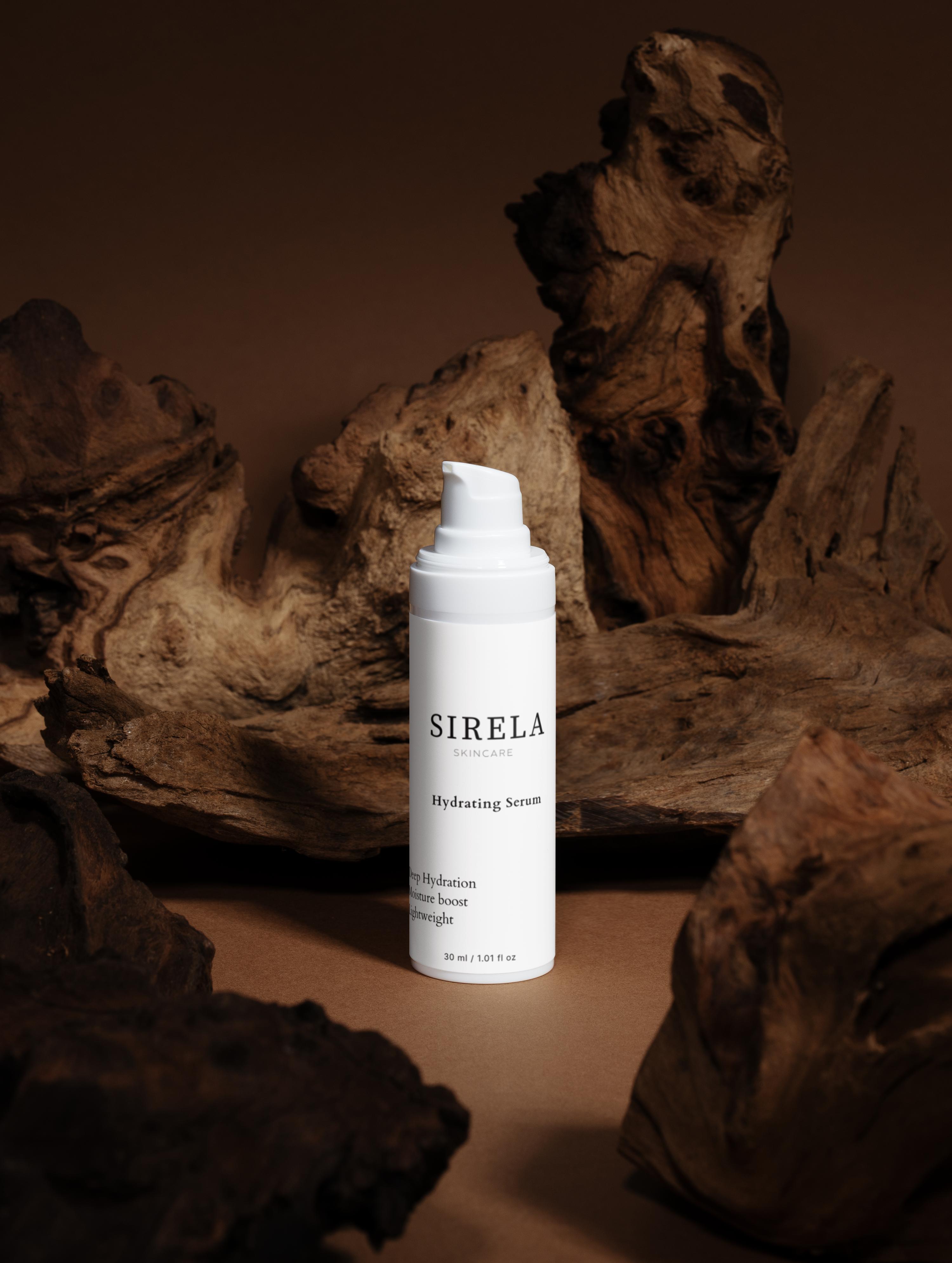 SIRELA skincare serum bottle on a wooden surface with a warm brown background