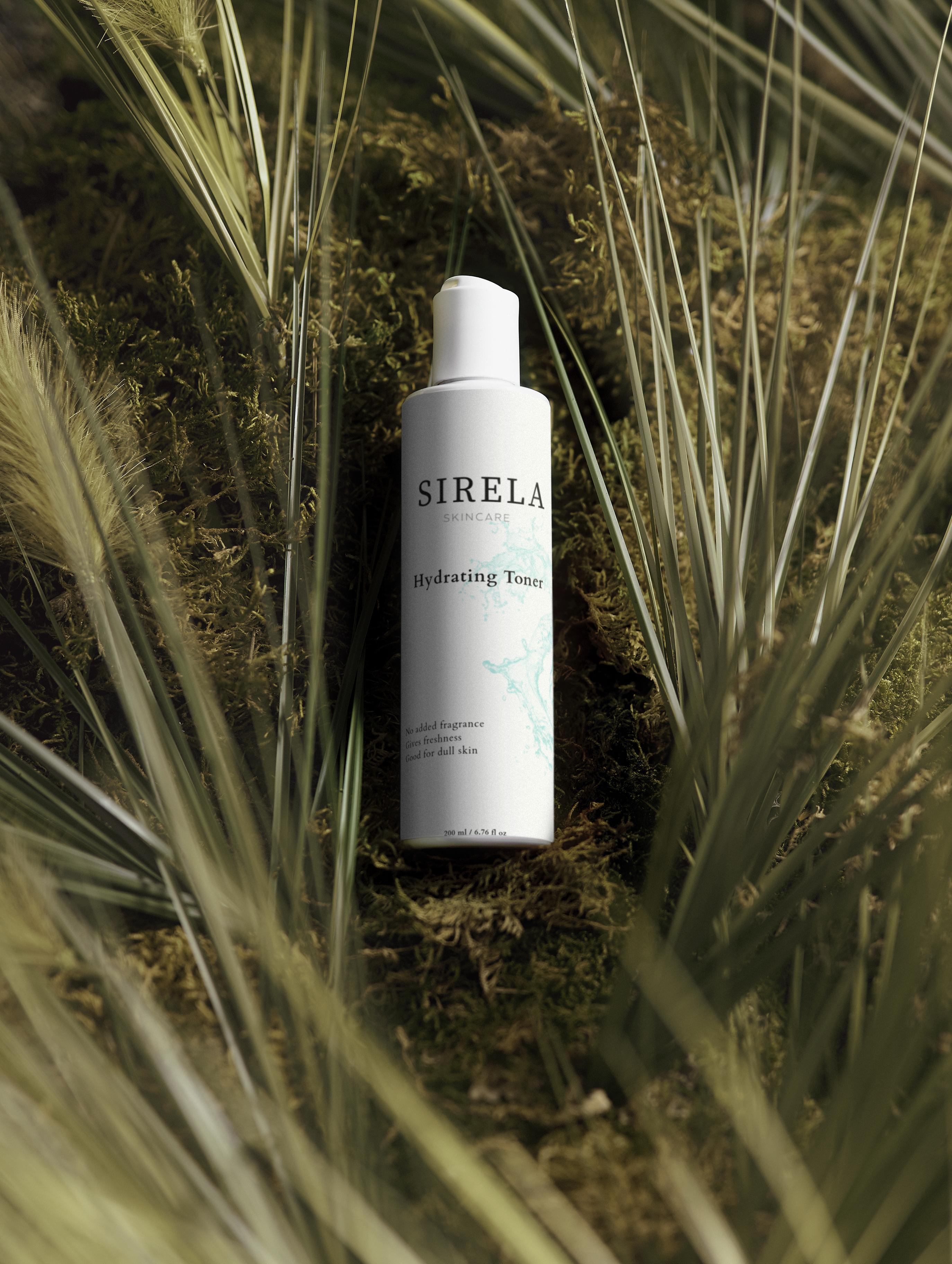 SIRELA toner bottle surrounded by grass and plants