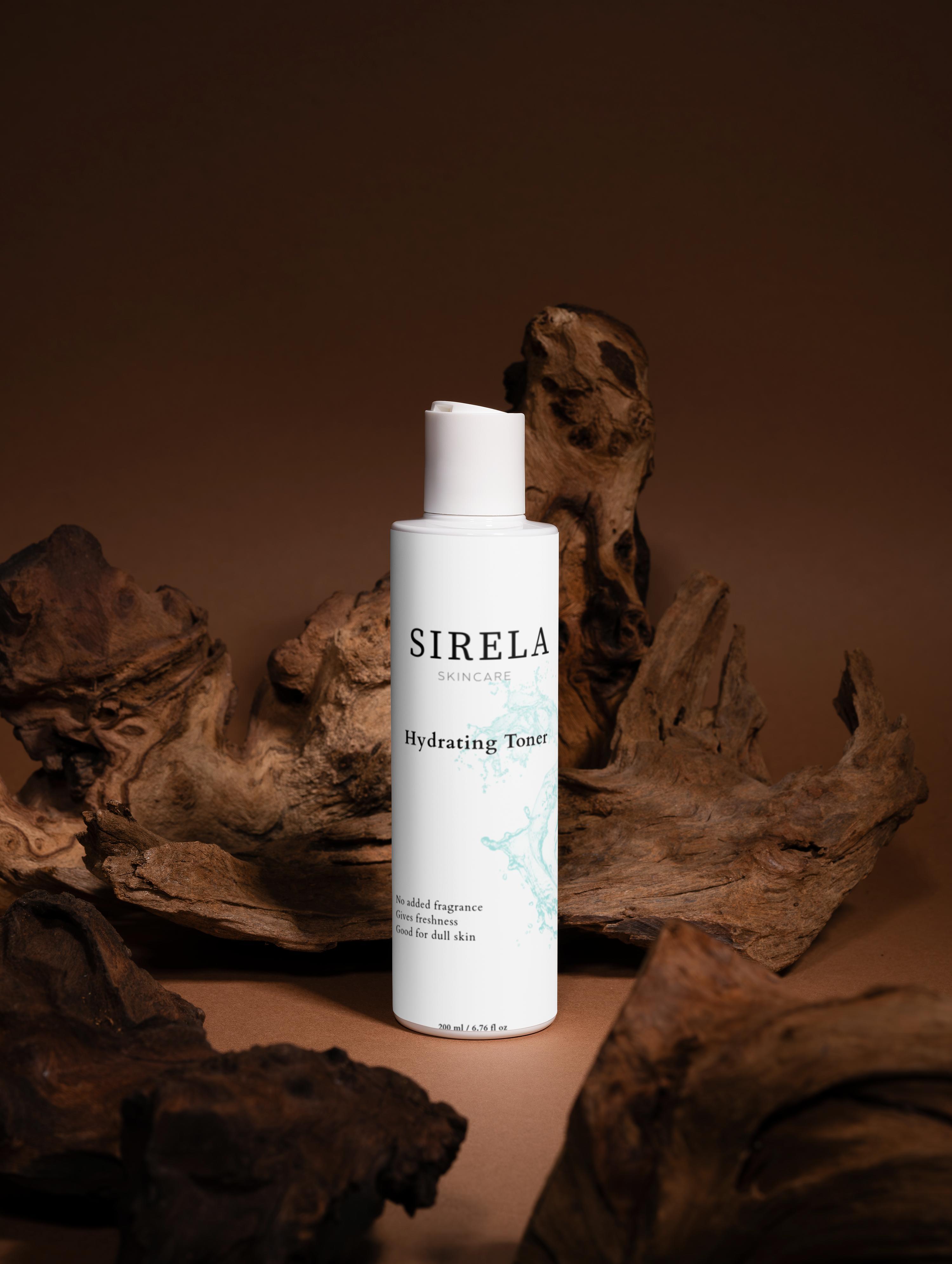 Sirela Hydrating Tonic bottle on a brown background with natural elements