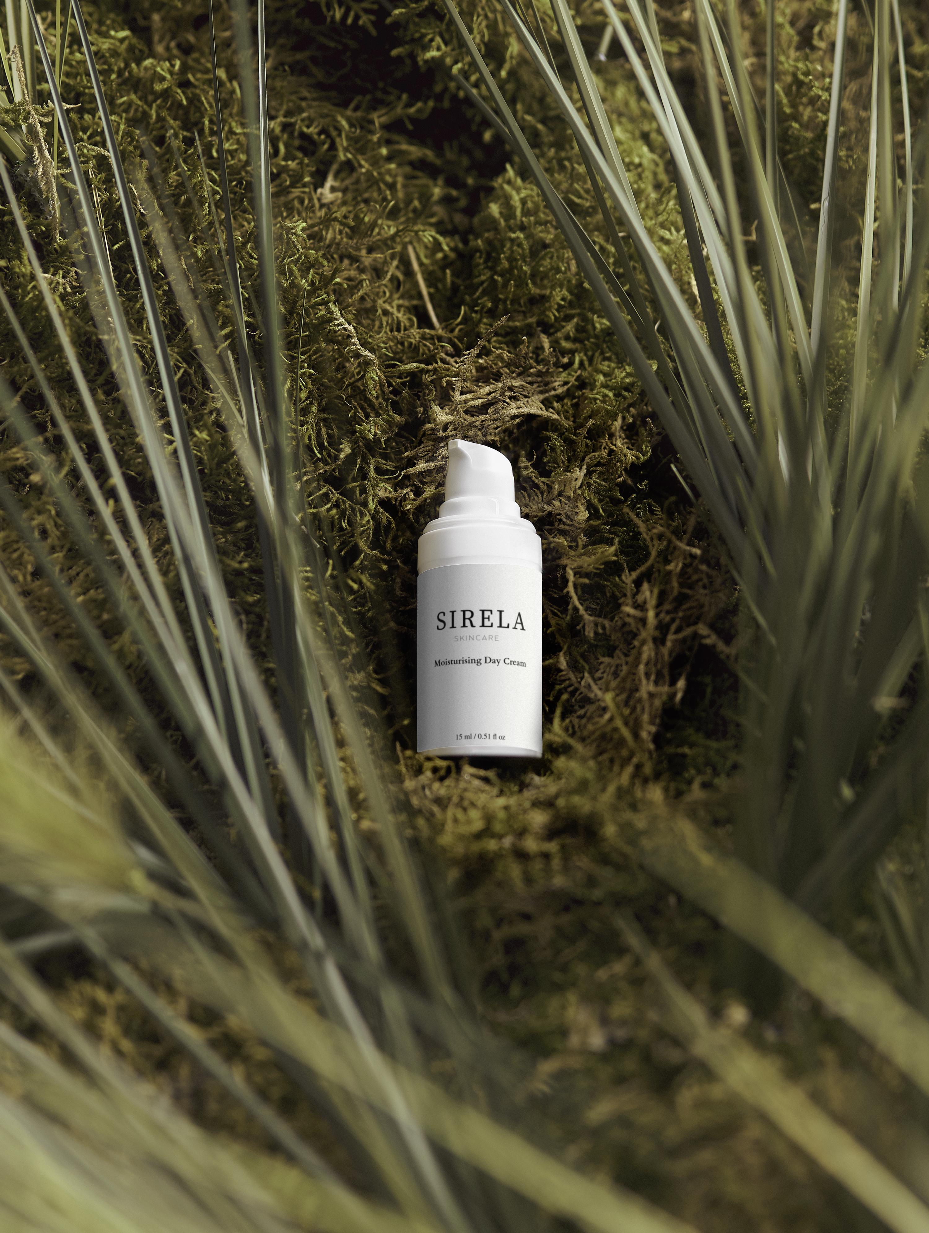 SIRELA skincare product in a natural setting with plants
