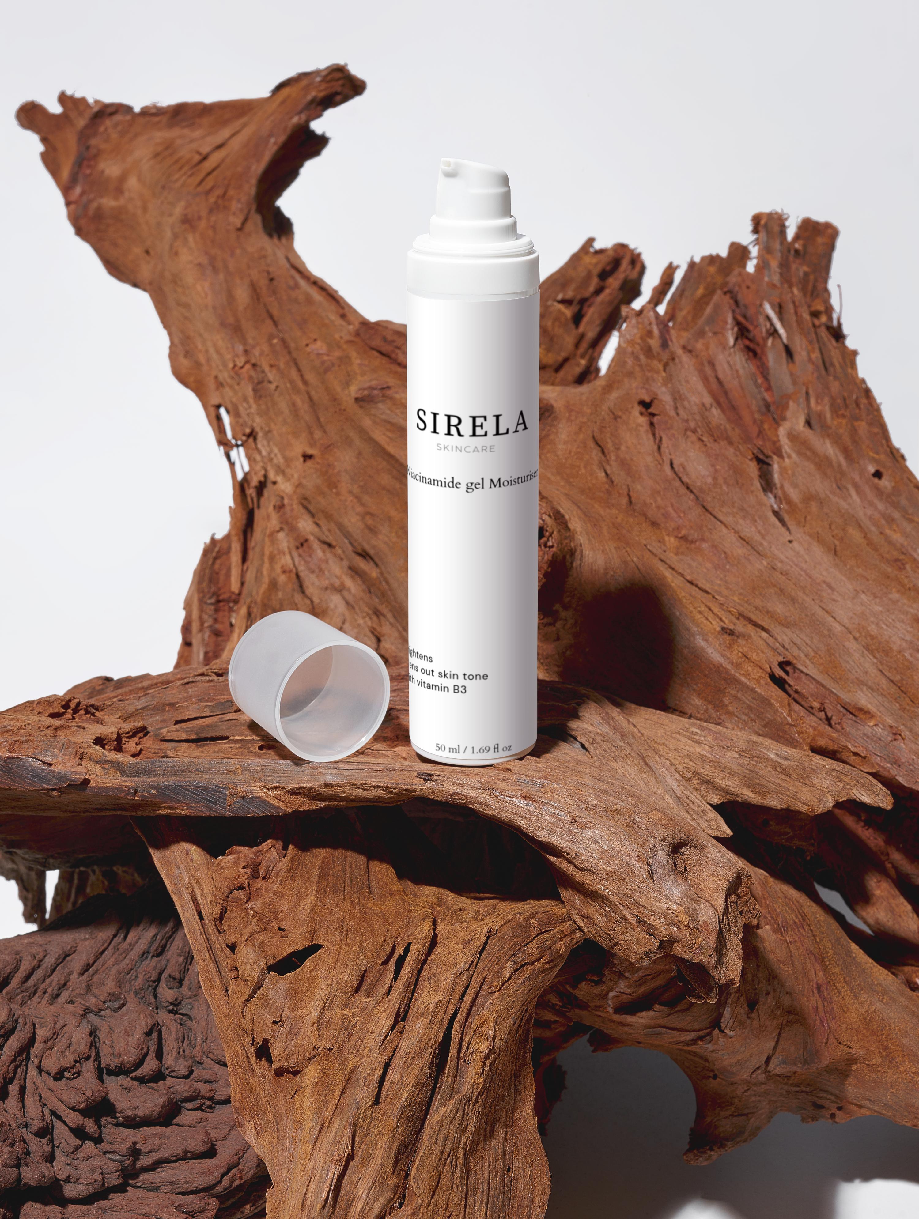 SIRELA bottle on a wooden surface with a white background