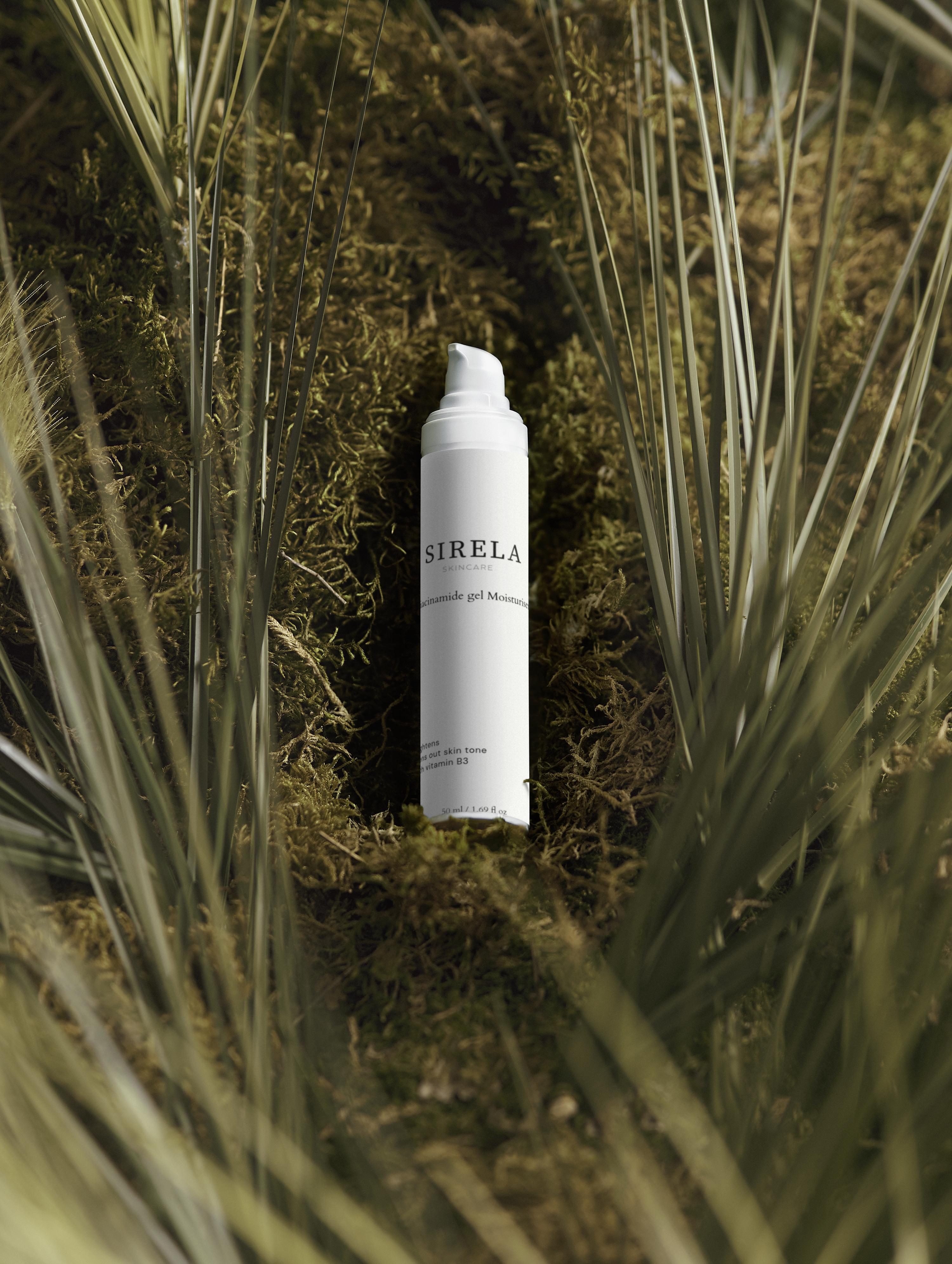 SIRELA bottle in a natural setting with grass and moss