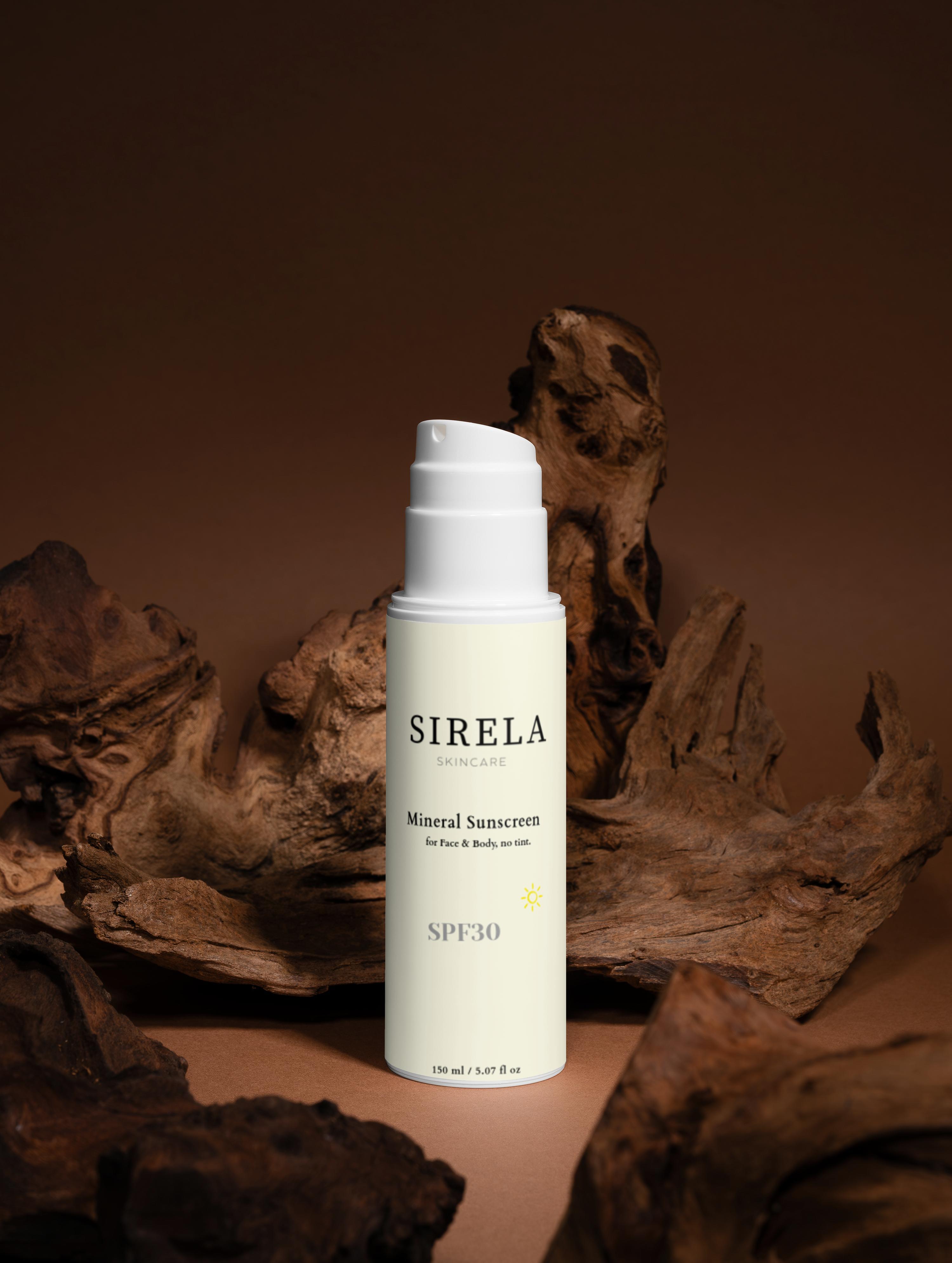 Sirela sunscreen bottle on a brown background with natural elements
